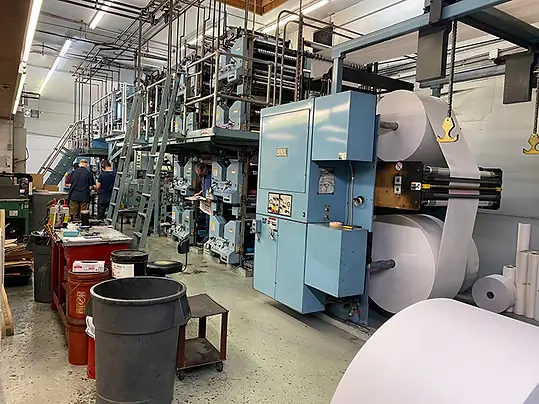 Paper rolls feeding the community web press
