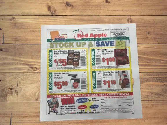 Red Apple grocery coupon circular printed on newsprint